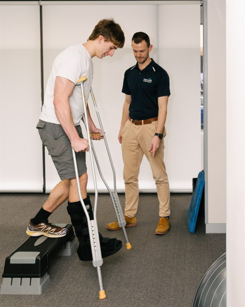 Hartwell Physio Learning to use crutches and moon boot from a Physio