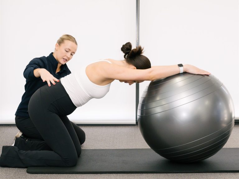 Physio assisting pregnant woman